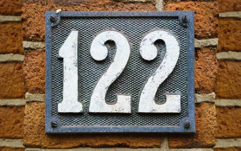Antique House Numbers in a simple white and black stamped and carved metal style
