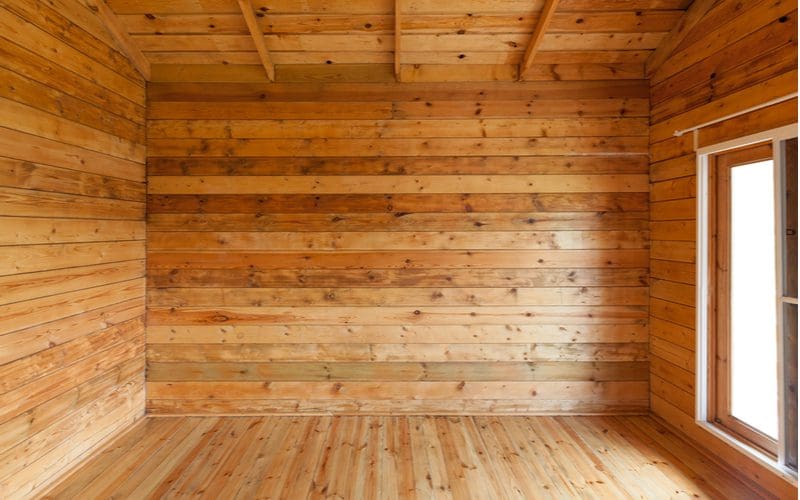 Idea for an interior cabin with natural pine wood flooring and wall covering