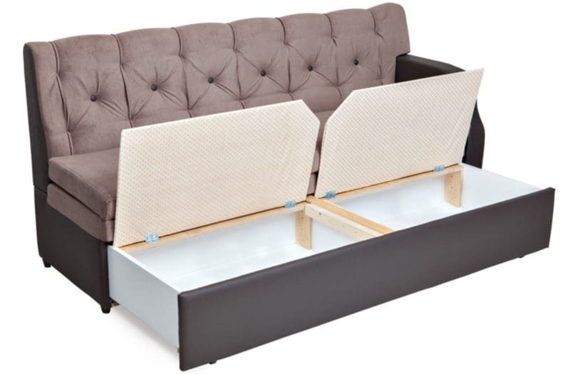 Living room toy storage idea featuring a sofa with a drawer underneath it with room for storage