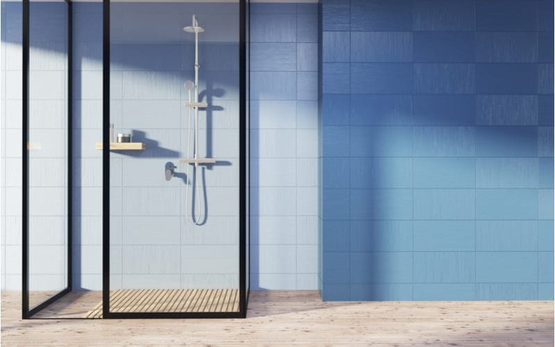 Glass Walled, Wooden Floor as an idea for a doorless walk-in shower