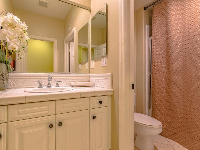 Hang Shower Curtains High Up as a small bathroom idea with tub