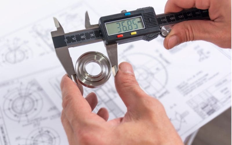 Digital caliper measuring a bearing for a piece on types of measuring