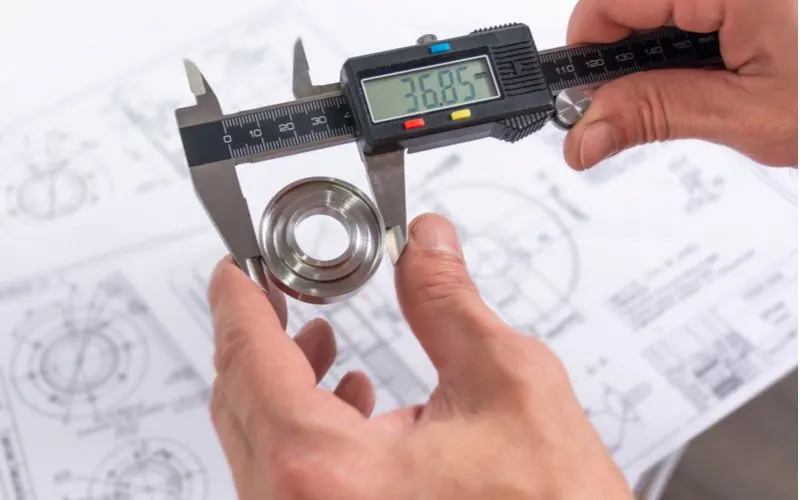 Digital caliper measuring a bearing for a piece on types of measuring