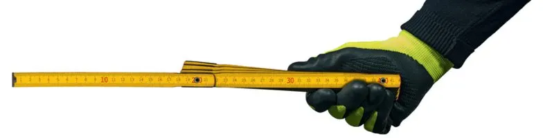 Rule and yardstick, types of measuring tools, being held by a gloved man