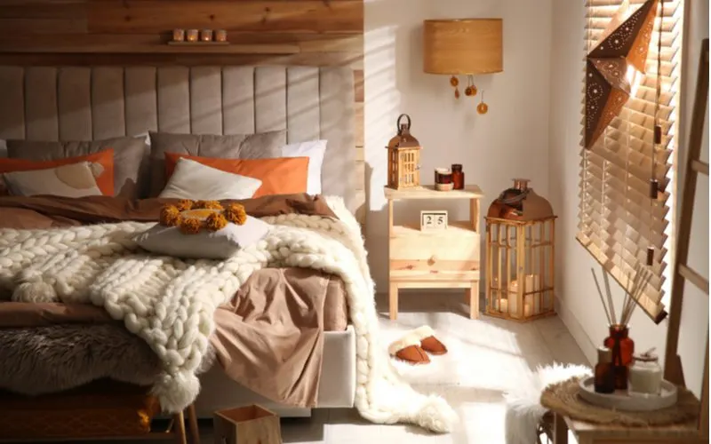 Natural materials scattered about in a room with white walls and wooden shiplap and wooden accents for a piece on room ideas