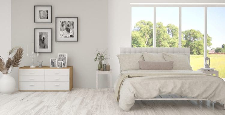 Image for a piece titled Room Ideas featuring light grey flooring, a large picture window overlooking the back yard, and three simple frames on a light grey wall
