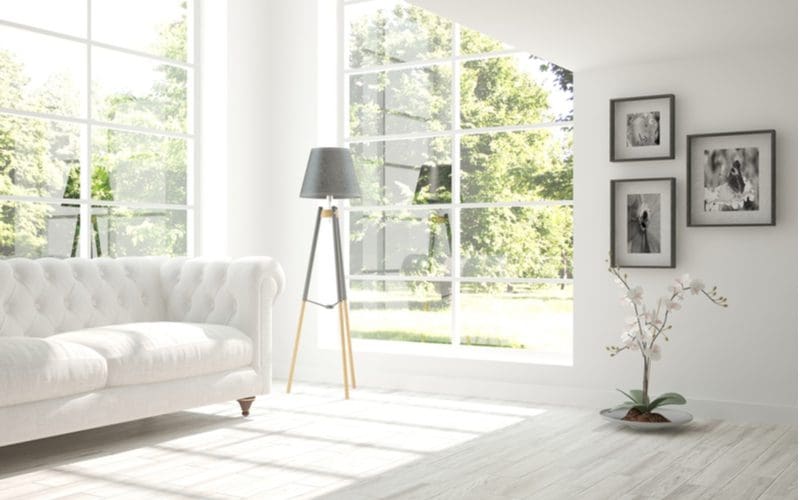 Unique Scandinavian-style lamp in an elegant and minimalistic living room shown for a piece on room ideas