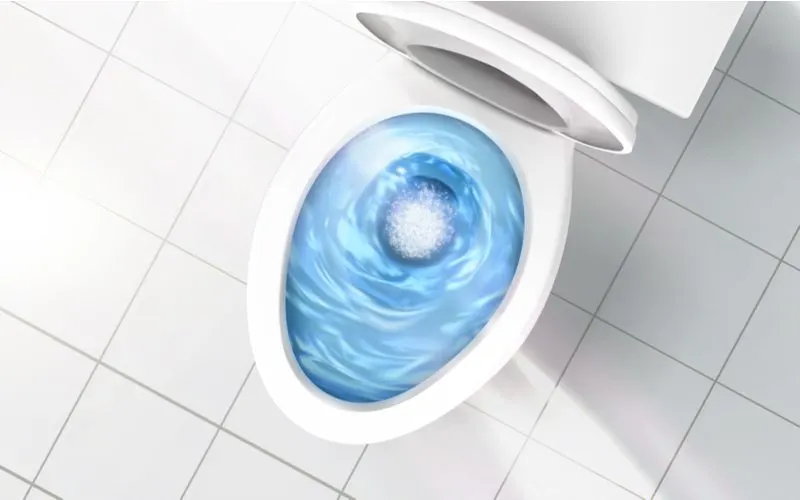 Graphic of the best flushing toilet with blue water swirling in a counterclockwise direction shown from above