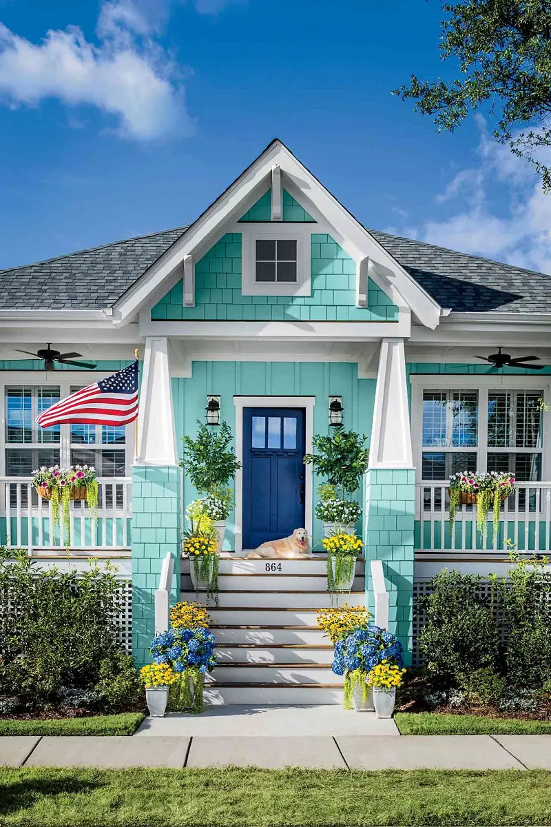 Green House with Blue Door and American Flag
