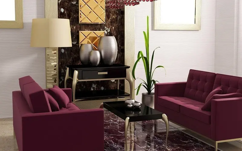 Maroon couch and gold decorations