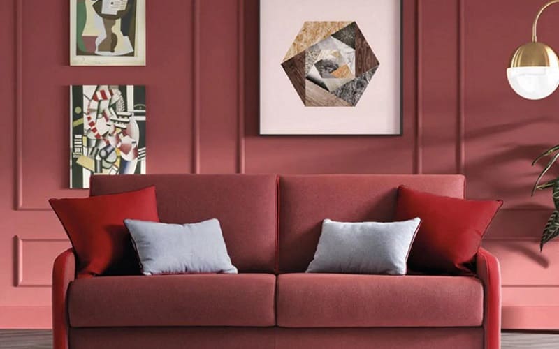 Maroon wall with red decorations living room
