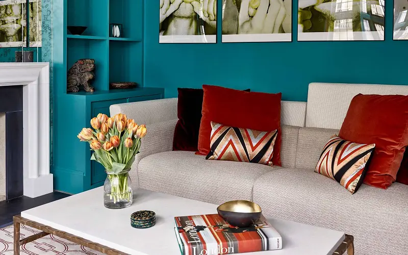 Maroon decoration pillows and teal wall