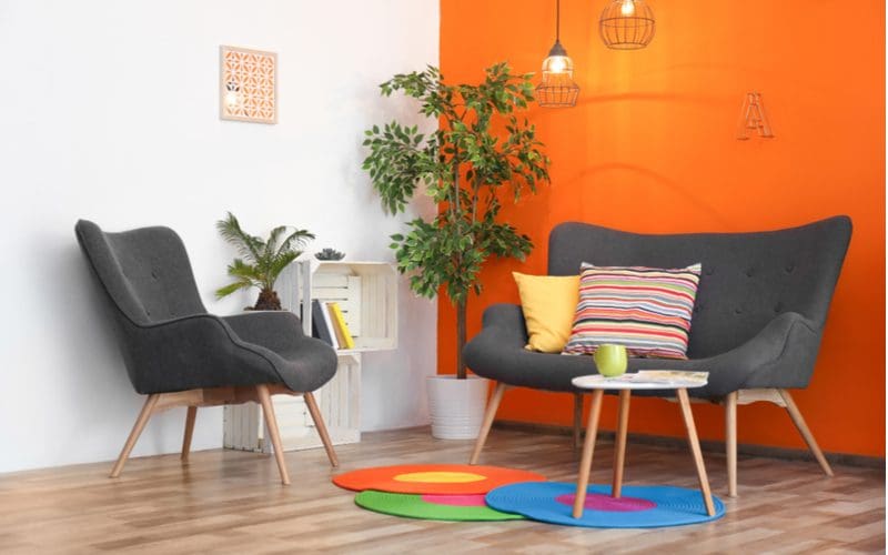 Orange, a color that does with gold, with funky boho-style chairs