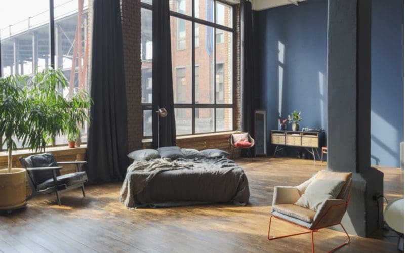 Loft With Dark Blue Walls and Curtains