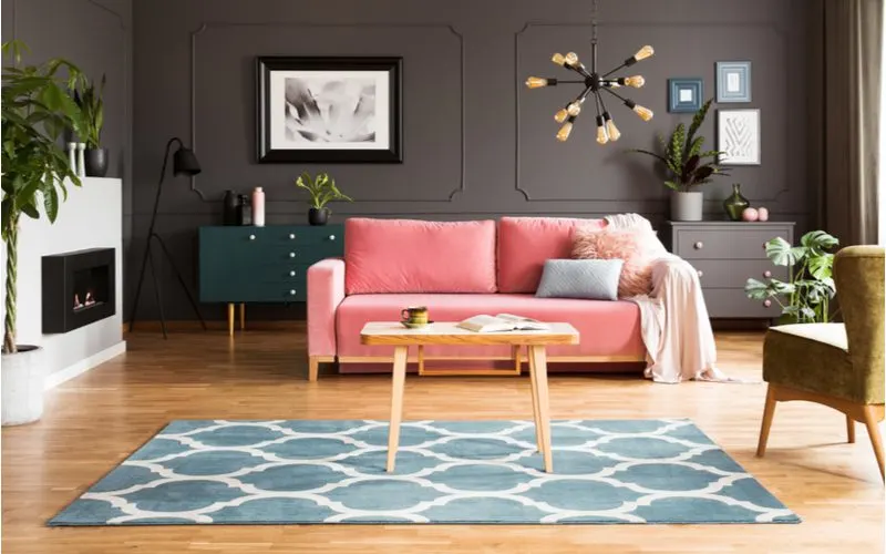 Pink sofa furniture color with dark gray walls
