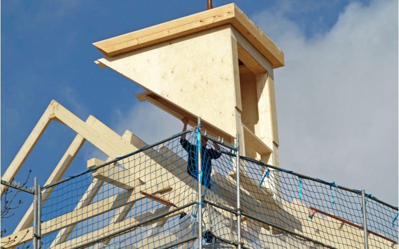 Guy installing one of the main dormer types on a roof