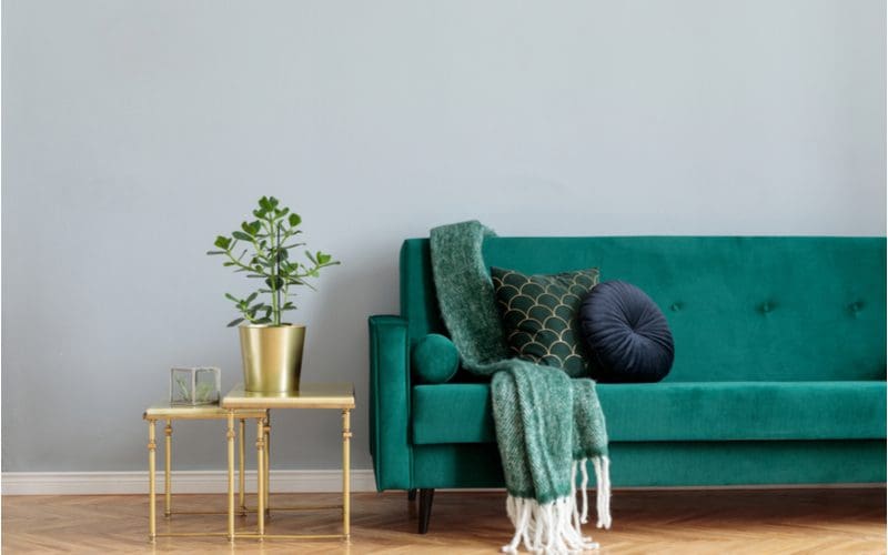 Colors that go with gold next to a green couch