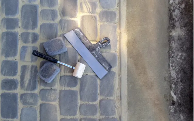 How to remove thinset from concrete with a mallet and a putty knife