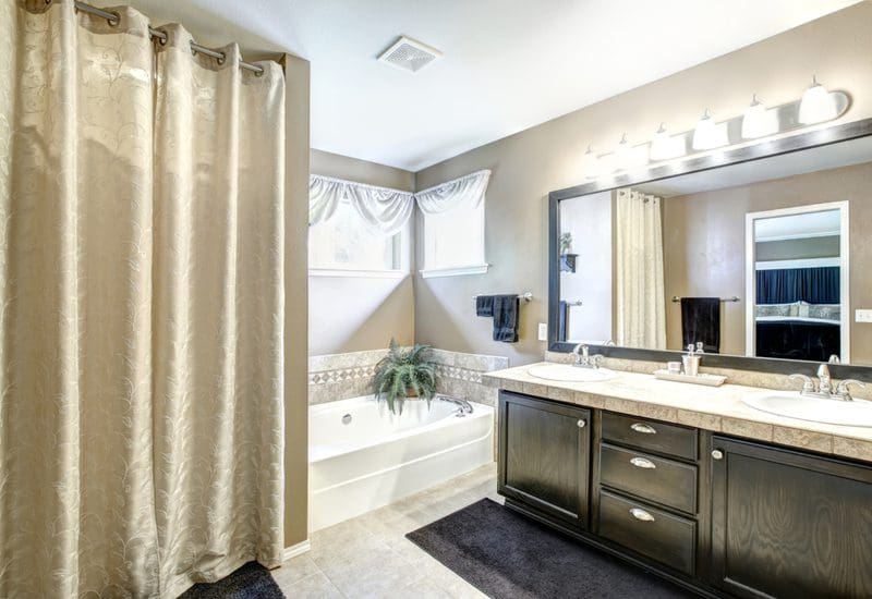 Standard length shower curtain in beige in a big master bathroom