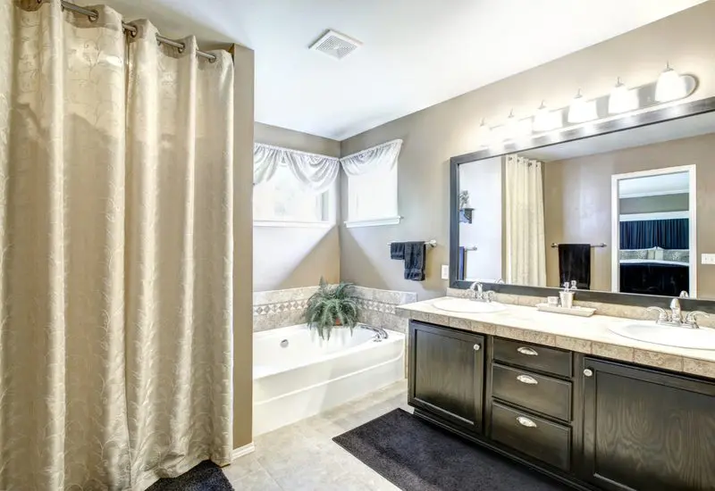 Standard length shower curtain in beige in a big master bathroom