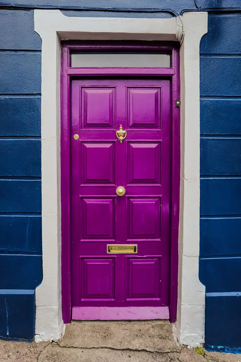 Royal Purple Front Door on a blue house