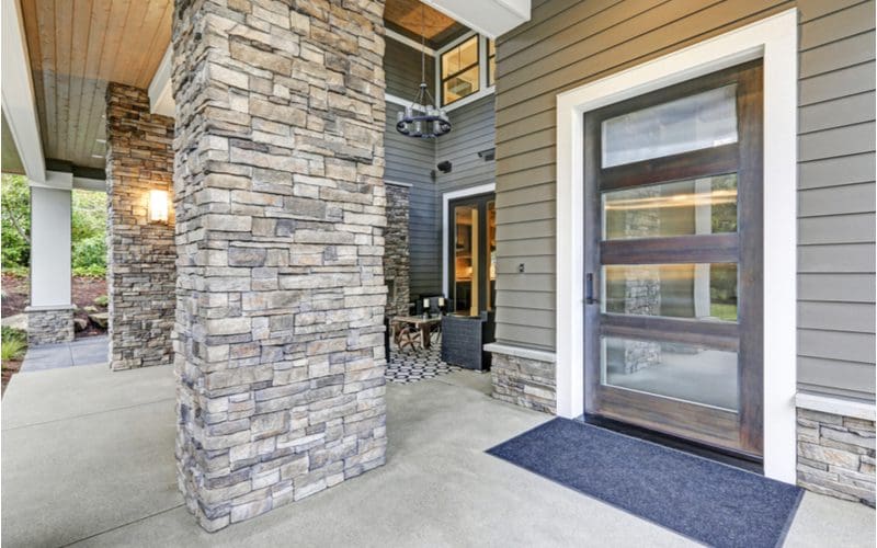 Gorgeous glass front door that looks onto a modern Seattle-style home