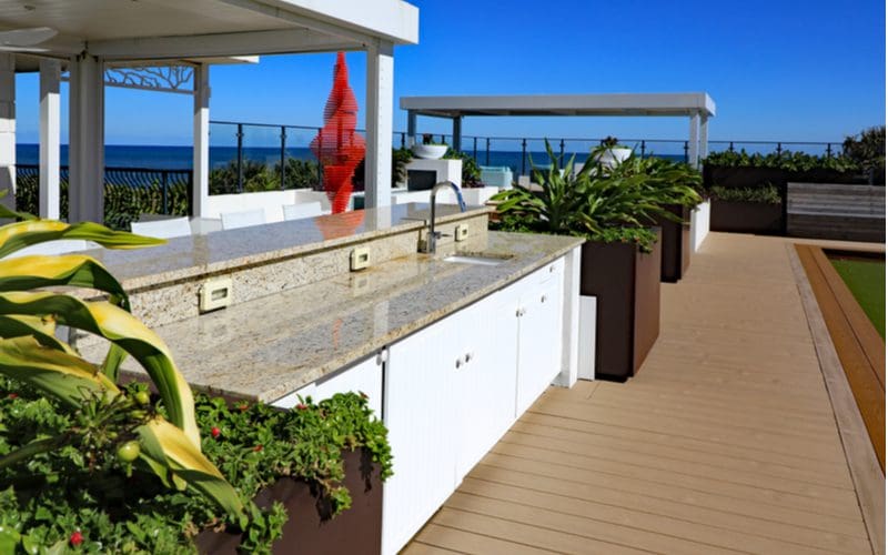 Tropical Terrace Kitchen with white granite countertops
