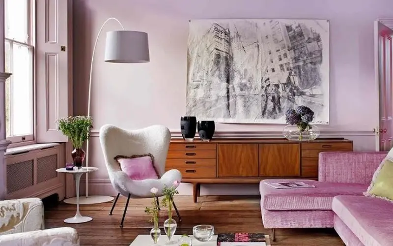 Bright pink sofa and Lavender wall inside pink decorated living room