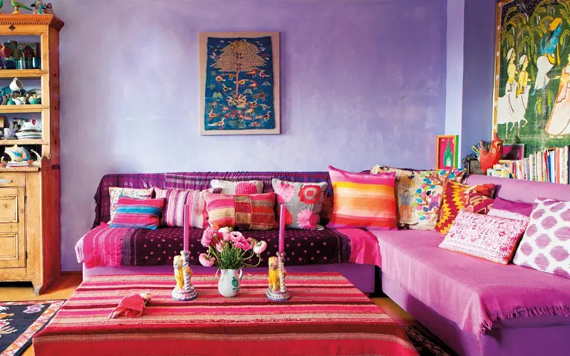 Vibrant magenta pillows combined with lavender wall