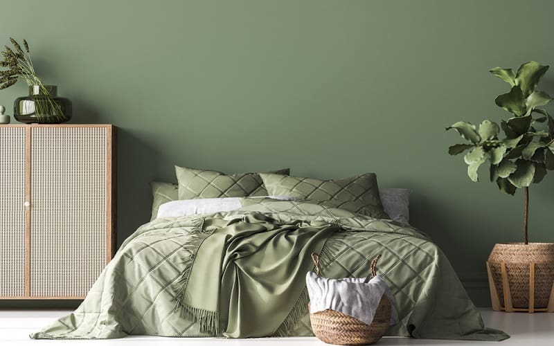 Tan details in bedroom with olive green walls