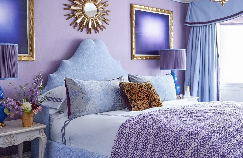 Bedroom with lavender wall and light blue bed and bedsheets