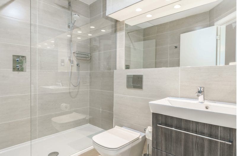 Small 8x8 bathroom layout idea with gray walls and a glass shower