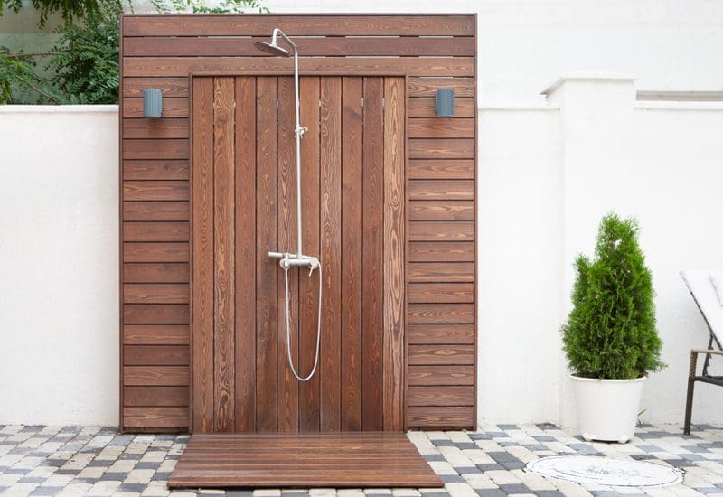 For a piece on Outdoor Shower Floor Ideas, a teak lined shower and surround