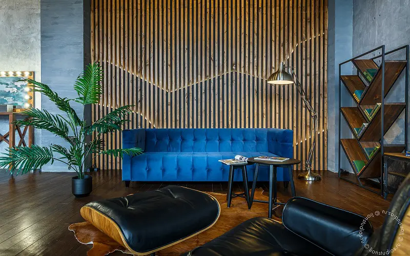 Blue sofa and wood panels color combination