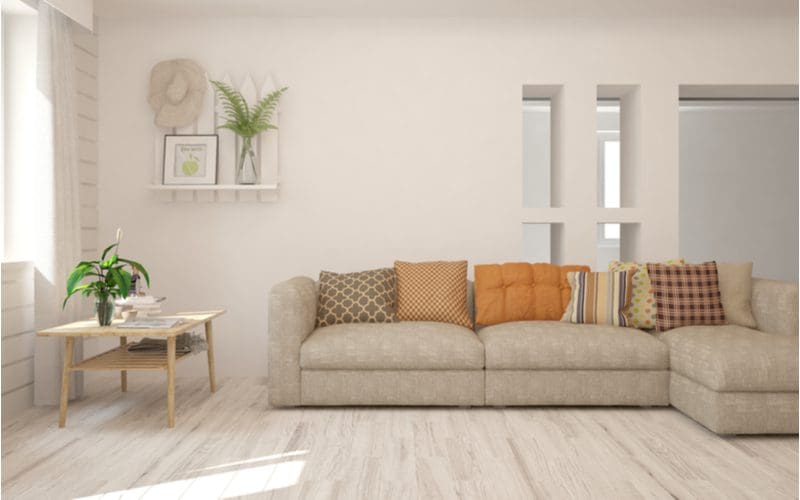 Light hardwood flooring with beige furniture