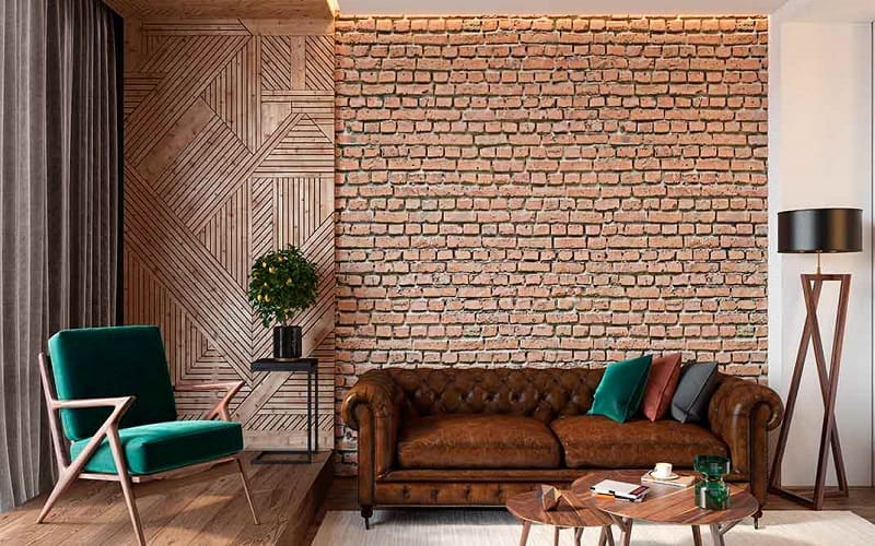 Dark brown sofa and green chair combined with brown brick wall