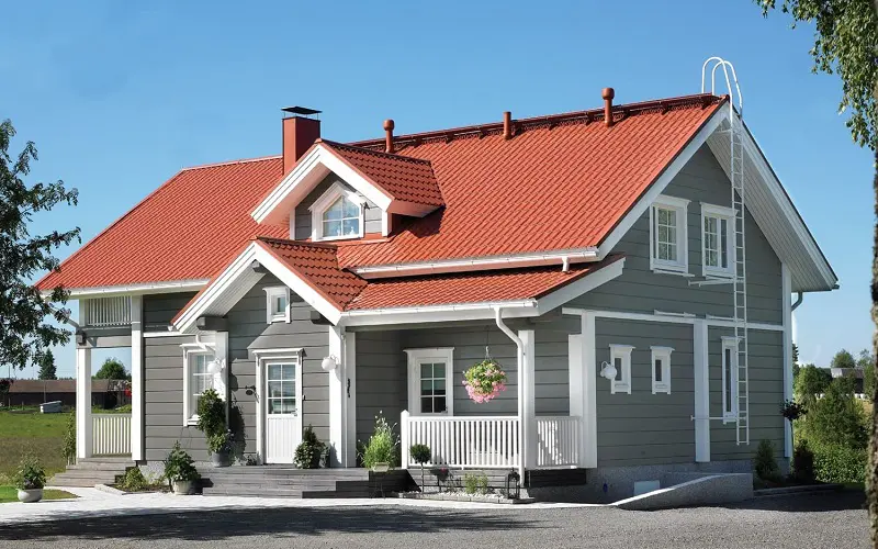 Scandinavian type of house with red roof and gray exterior color