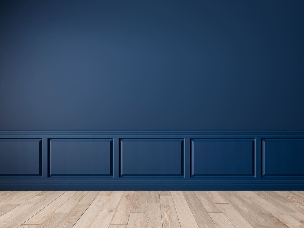Painted wall next to a brown-grey room for a piece on colors that go with royal blue