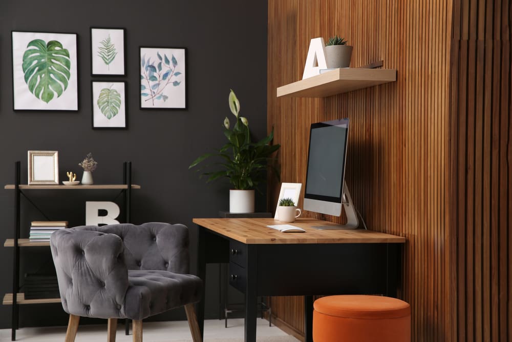 Desk with brown and grey in the room for a piece on colors that go with black
