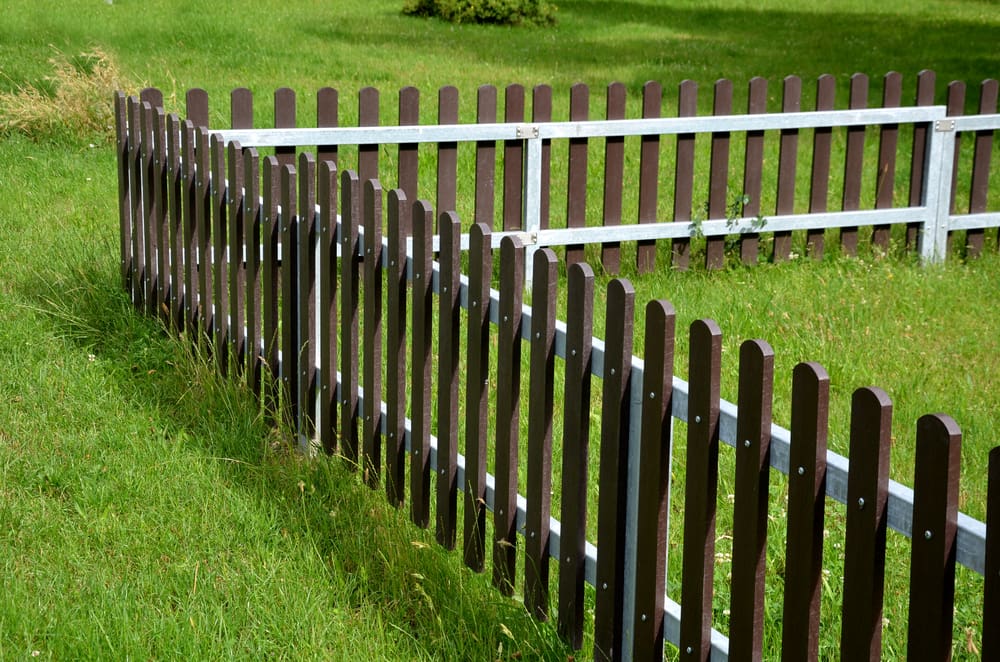 Composite slats made of composite running along a yard for a piece on the best types of fences for a yard