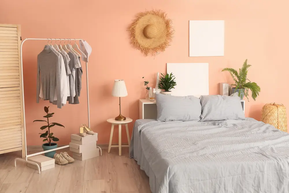 Bedroom with several colors that go with peach in a boho-type style