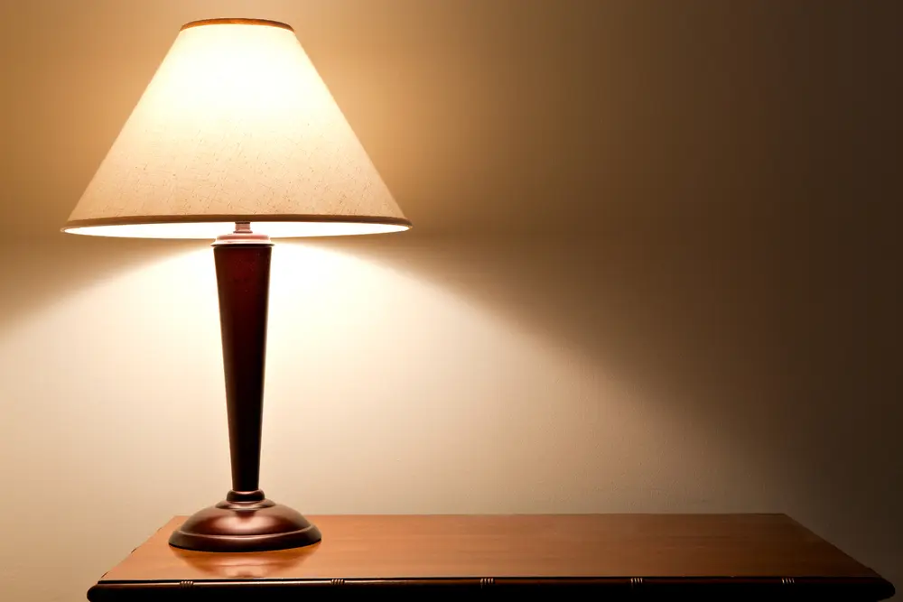 End table lamp with a triangular shade for a piece on parts of a lamp