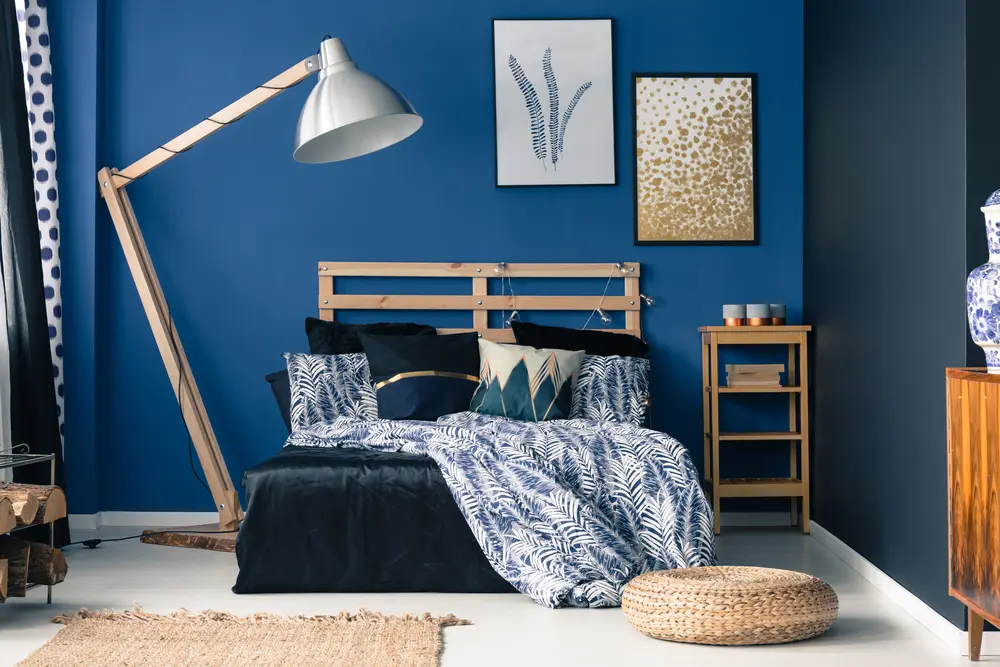 For a piece on colors that go with royal blue, a silver lamp and brown boho-styled decorations