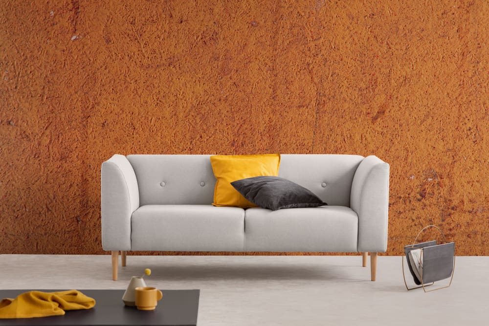 Grey and yellow, colors that go well with burnt orange, in a living room