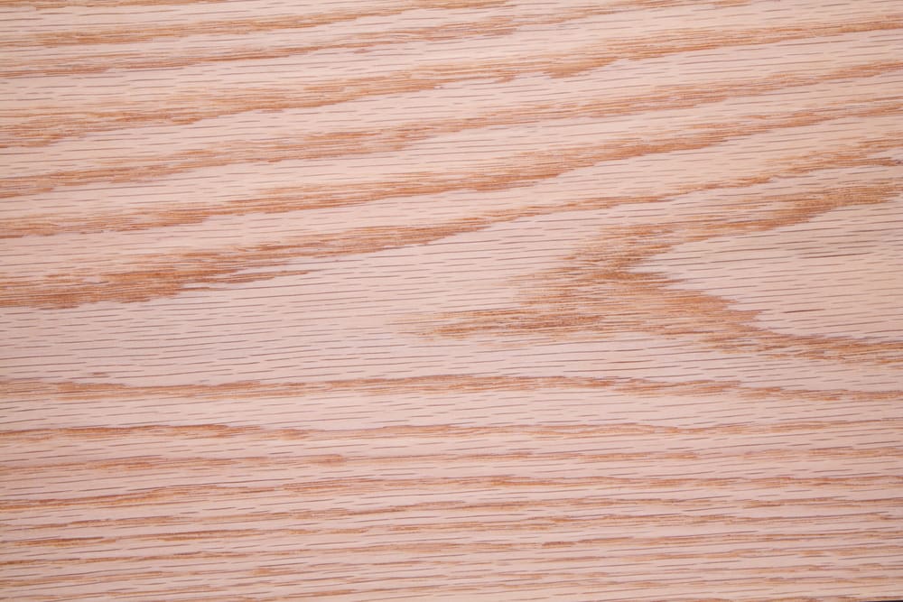 White oak, one of the best types of wood grain patterns, pictured on a board