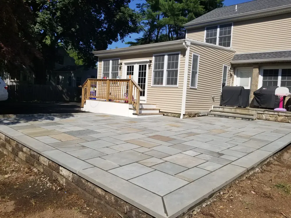Bluestone patio in a back yard for a piece on the best types of pavers