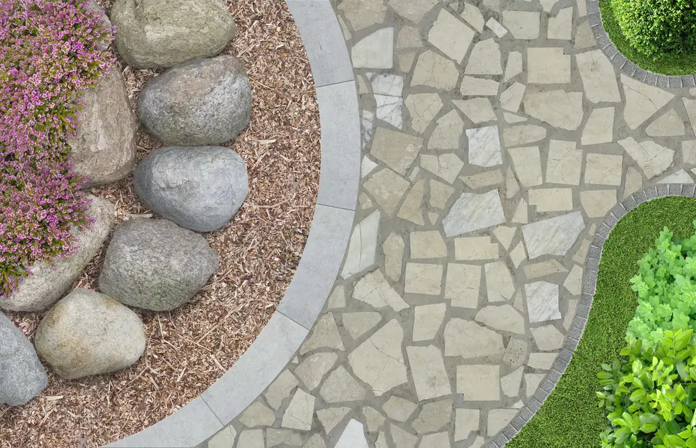Aerial shot of some of the most popular types of rocks for landscaping, flagstones and river rock and boulders