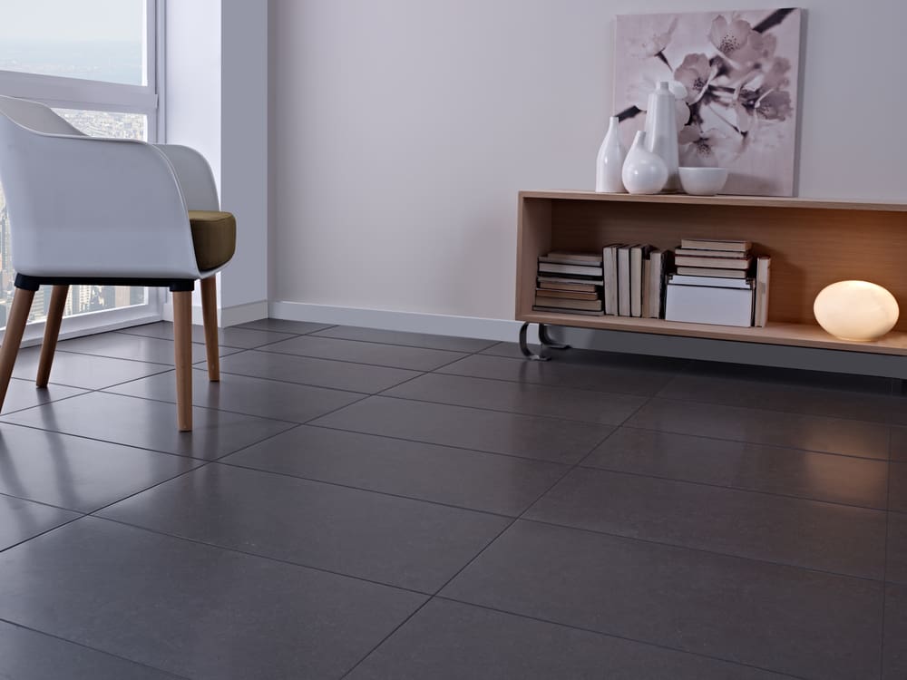 Dark grey ceramic tile that is slate in color pictured for a roundup of the best types of tile for flooring