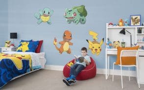 Boy in bedroom with his favorite pokemons