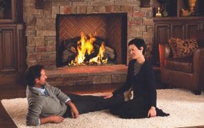 Happy couple by the fireplace
